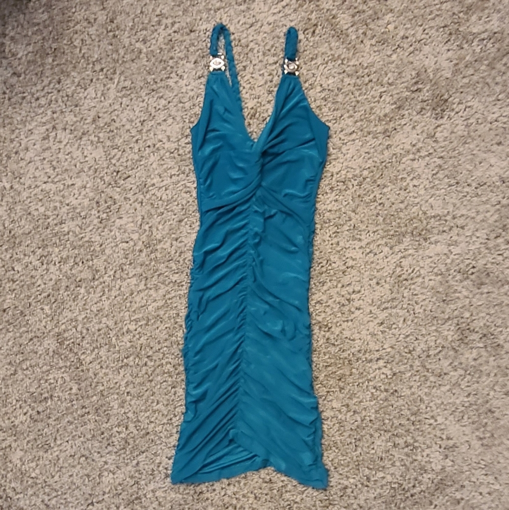 Teal Form-Fitting Dress with Silver Accessories